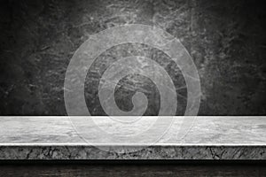 Empty grey marble tabletop with dark cement stone background