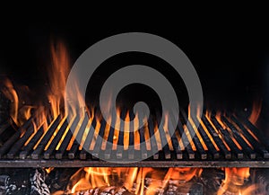 Empty grill grate and tongues of fire flame. Barbeque night background photo