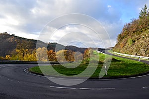 empty hairpin curve of a country road