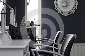 Empty hairsalon with two chairs