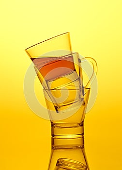 Empty and half full double glass tea cups standing like a pyramid