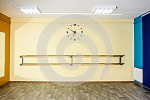 Empty hall dance hall with clock on the wall