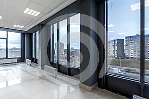 empty hall room with columns, doors and panoramic windows in modern office