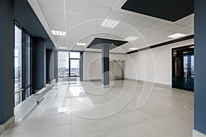 empty hall room with columns, doors and panoramic windows in modern office