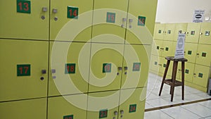 An empty hallway in a college library with a loker