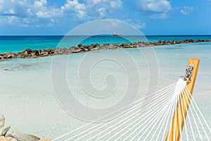 Empty hammock on tropical beach