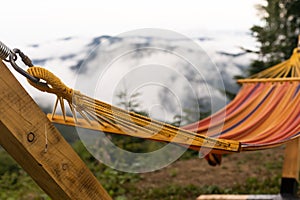 Empty hammok hanging in the mountains in summer