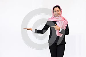 Empty hand holding of businesswoman in suit wearing pink turban