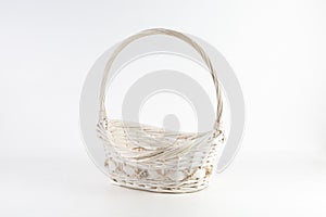 Empty handmade weaved basket for fruits isolated on a white background