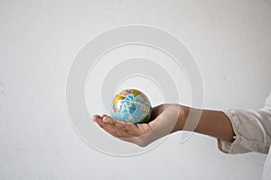Empty hands holding the ball symbol world,concept:responsibility Save the earth for human,Abstract: Ecology The development of