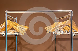 Empty hangers on coat rack with no clothes in cloakroom