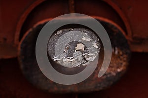 Empty hawse in old red rusted ship hull