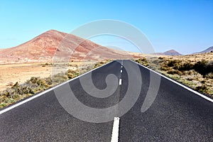 Empty highway asphalt road and mountain landscape