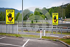 Empty highway in the austrian countryside with the STOP/ FALSCH stop / false sign to warn the drivers