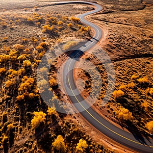 An empty highway is captured from a top-down perspective, offering an aerial view of the great landscape it traverses