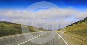 Highway landscape with moving cars at daytime