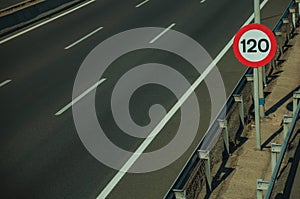 Empty highway with SPEED LIMIT signpost in Madrid photo