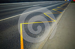 Empty highway with yellow road marking bokeh backdrop