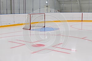 empty hockey field, arena with ice and markings and gates