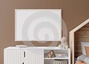 Empty horizontal picture frame on brown wall in modern child room. Mock up interior in scandinavian style. Free, copy