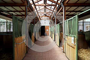 Horizontal picture of empty clear horse stable without horses