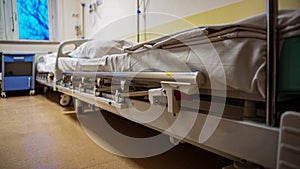 Empty hospital bed on hospital ward. Health care concept