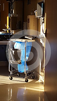 Empty hospital room with trash container, ready for next patient