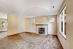 Empty house interior. Bright ivory living room with fireplace