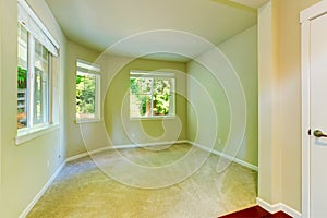 Empty house interior. Simple bedroom with three windows