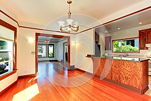 Empty house interior in soft ivory with brown trim