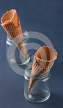Empty ice cream cone. Blue background. Space for text