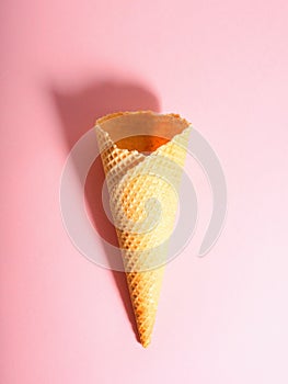 Empty ice cream waffle cup, cone cone on pink background