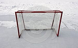 Empty ice hockey goal outdoors