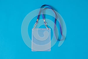 Empty ID card badge icon with blue belt, on blue background.