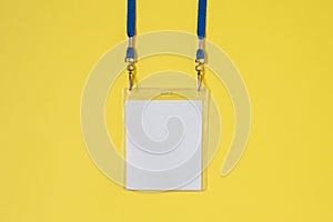 Empty ID card badge icon with blue belt, on yellow background.