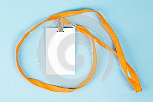 Empty ID card / icon with an orange belt, on a blue background.