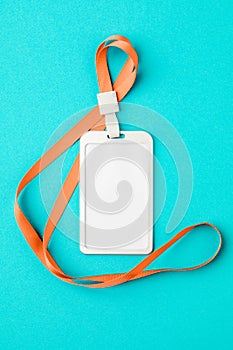 Empty ID card / icon with an orange belt, on a blue background. Space for text