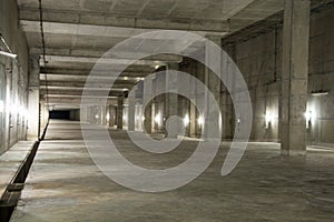 Empty industrial garage room interior with concrete