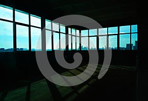 Empty industrial room with multiple windows background