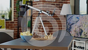 Empty interior with chess board game and chips on table