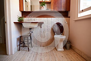 Empty Interior Of Contemporary Cloakroom With Sink And Toilet