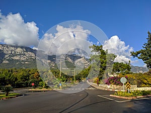 Empty intersection on the road with a beautiful view in Kemer, Turkey