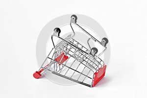 Empty inverted shopping cart on white background - Concept of shopping cart abandonment photo