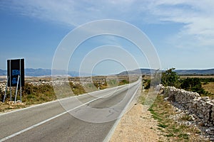 Empty Island Road with Mountains in Distance