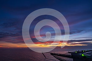 Empty jack up oil rig helipad at sunset time