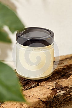 Empty jar for cosmetics. Mockup for natural cosmetics. Aesthetic composition with aromatic candle in jar. Mockup soy wax candle in