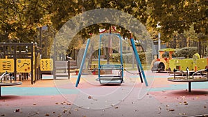 Empty kids playground in the autumn