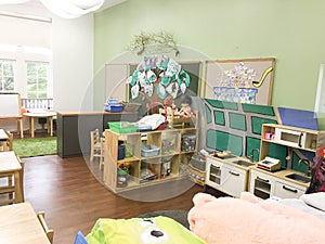 empty kindergarten class room with kids stuffs and toys photo