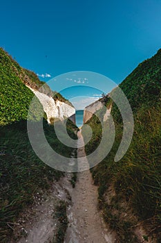 Empty Kingsgate Beach, walking through the chalk stacks clifs at Botany Bay in Kent, England