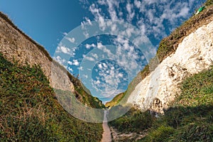 Empty Kingsgate Beach, walking through the chalk stacks clifs at Botany Bay in Kent, England